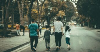 Family of our walking down a road.