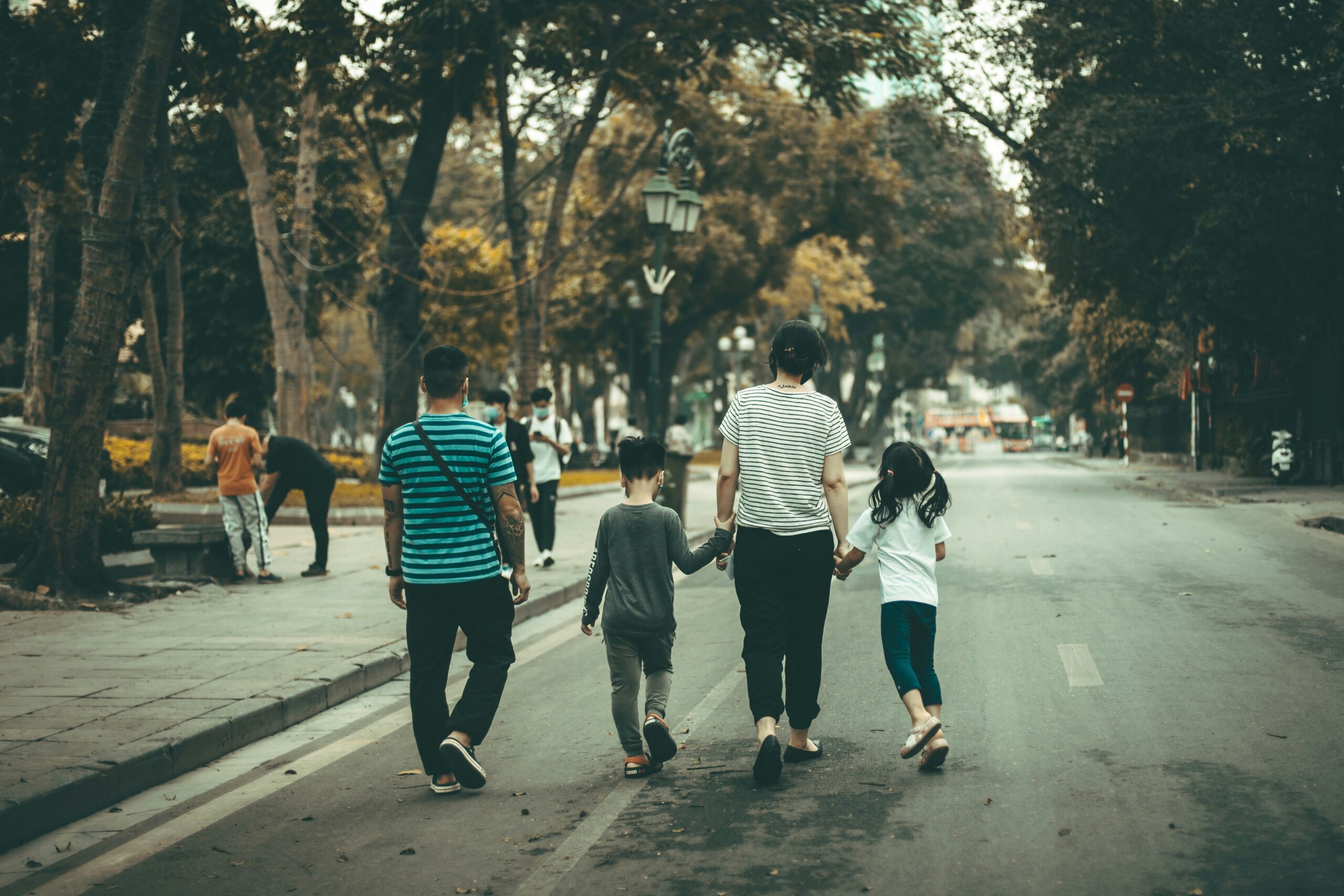 Family of our walking down a road.